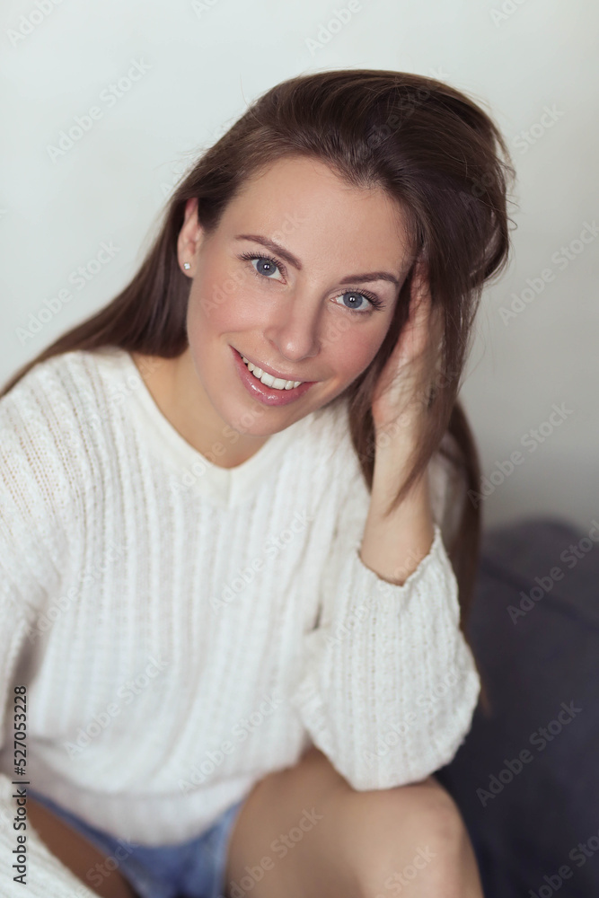 Effortlessly Beautiful: Lovely Girl Strikes a Pose on a Grey Background, Exuding Confidence and Radiance Effortlessly Beautiful: Lovely Girl Strikes a Pose on a Grey Background, Exuding Confidence and Radiance