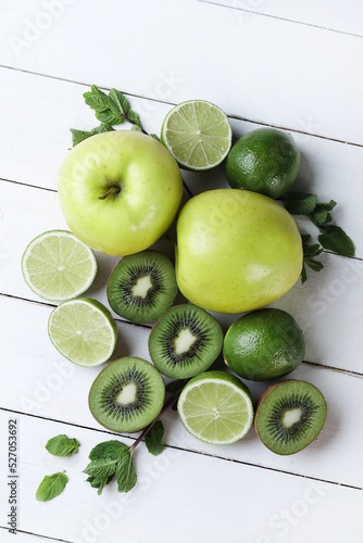 Green fruits sliced on the wood