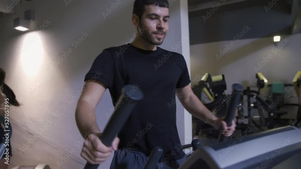 man does muscle building in a gym man does muscle building in a gym