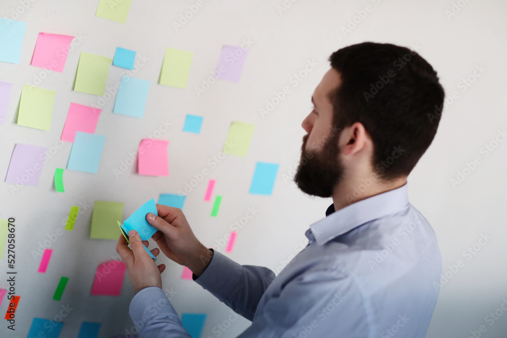 The Struggle for Success: Businessman's Fatigue Evident as He Pushes Through to Create the Next Big Idea The Struggle for Success: Businessman's Fatigue Evident as He Pushes Through to Create the Next Big Idea