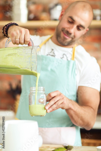 Healthy Habits in the Kitchen: Fitness Man Cooks Up a Delicious and Nutritious Salad and Milkshake