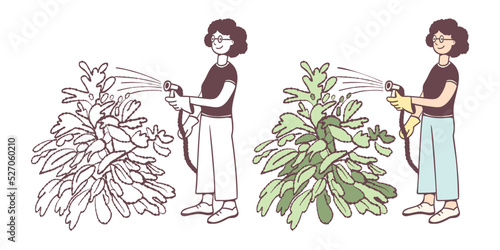 A woman is watering plants in the garden.