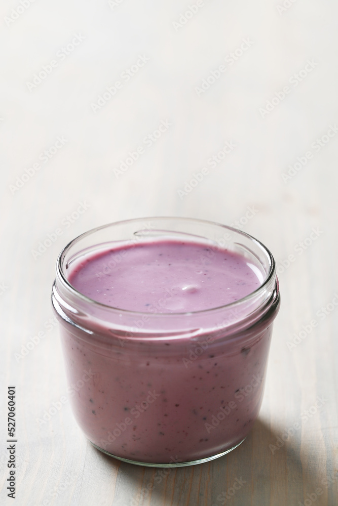 Homemade cooked healthy granola for breakfast in a wooden bowl on the table and near a bottle of milk. Place for text. Fitness food, snack Homemade cooked healthy granola for breakfast in a wooden bowl on the table and near a bottle of milk. Place for text. Fitness food, snack