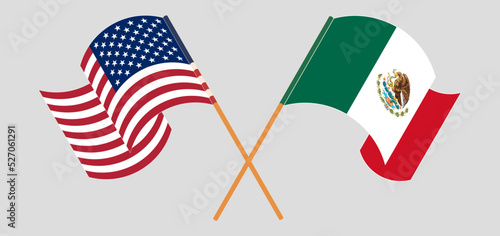 Crossed and waving flags of the USA and Mexico