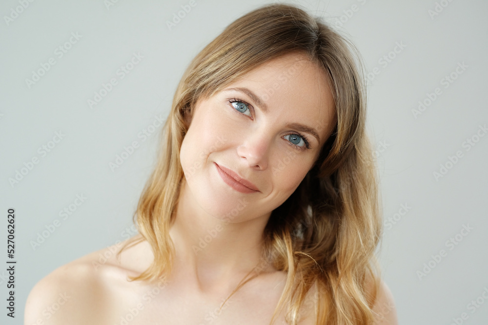 Picture of of young blond woman looks at camera and pose at home Picture of of young blond woman looks at camera and pose at home