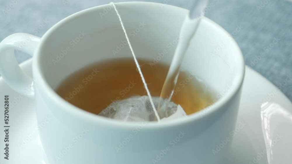 green tea and tea bag on table, close up. green tea and tea bag on table, close up.