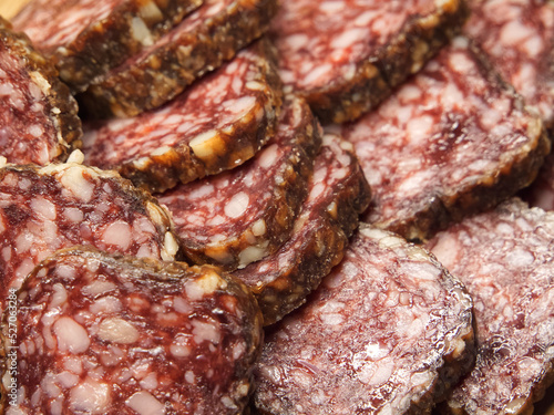 Chunks of dried sausage taken in macro. Meat products. Sausage full frame.