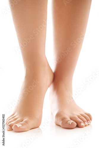 Smooth groomed women’s legs on white background © racool_studio