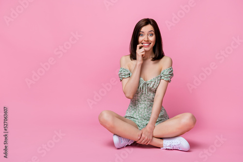 Full size photo of funny millennial lady sit near empty space wear dress shoes isolated on pink color background