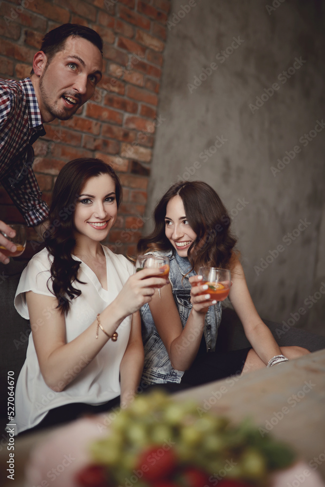 Two young girls drinking and having fun 