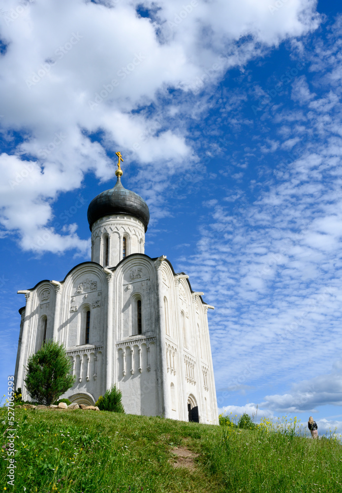 View of the church of Pokrova-na-Nerli, year 1165, on a hill in Bogolyubovo, Russia