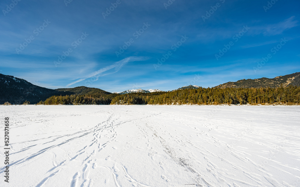 winter landscape in the mountains from frozen lake eibsee