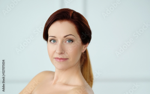 Close-up portrait of a beautiful,mature woman with blue eyes looking into the camera 