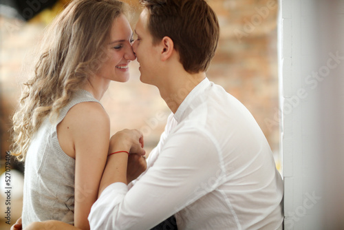 Photoshoot of a young couple of woman and man spending time together