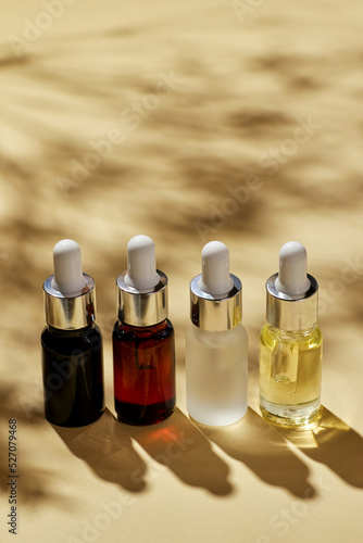 Various spa cosmetics, oils for facial massage in glass bottles.