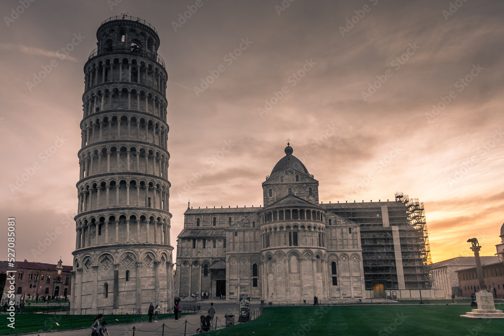 Pisa, Italy, 14 April 2022:  View of the Cathedral and the leaning tower at sunset
