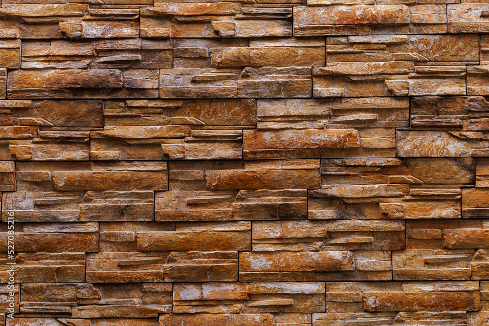 Textured rough surface of decorative natural stone wall. Background or backdrop. A blank for design Textured rough surface of decorative natural stone wall. Background or backdrop. A blank for design