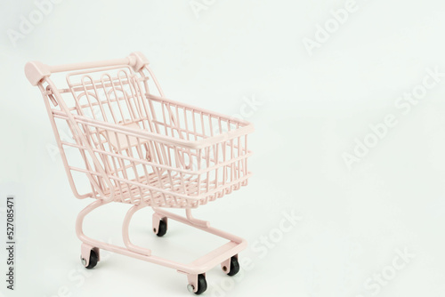 Classic light pink shopping cart isolated on white background.