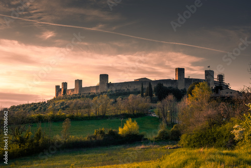 Sunset over the medieval fortified town of Monteriggioni, Tuscany, Italy