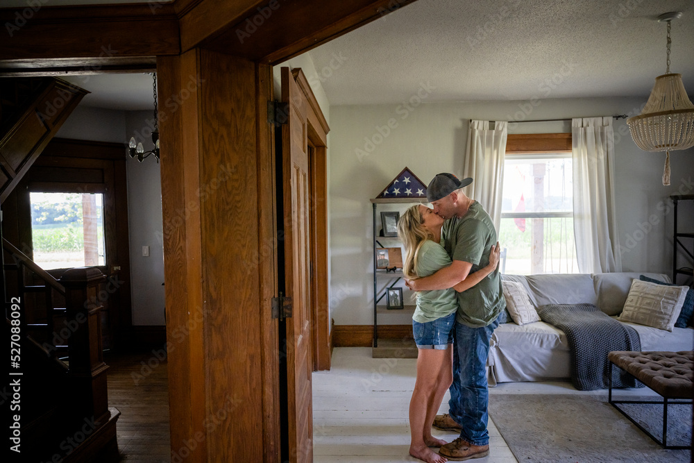 Marine veteran at home sharing a moment with wife.