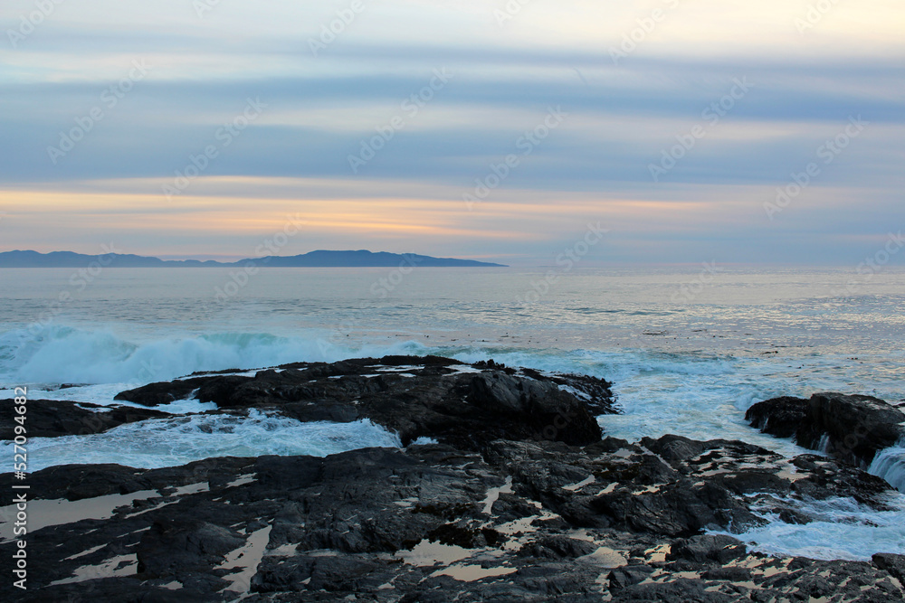 Sunset over sea rocky beach waves Sunset over sea rocky beach waves