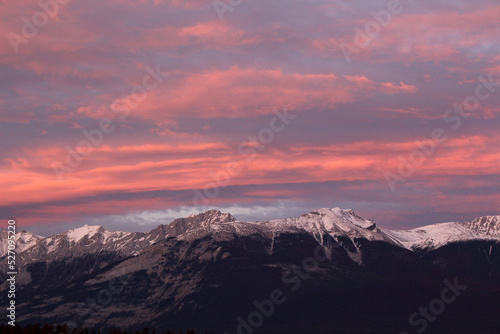 Sunset over snowy mountains landscape