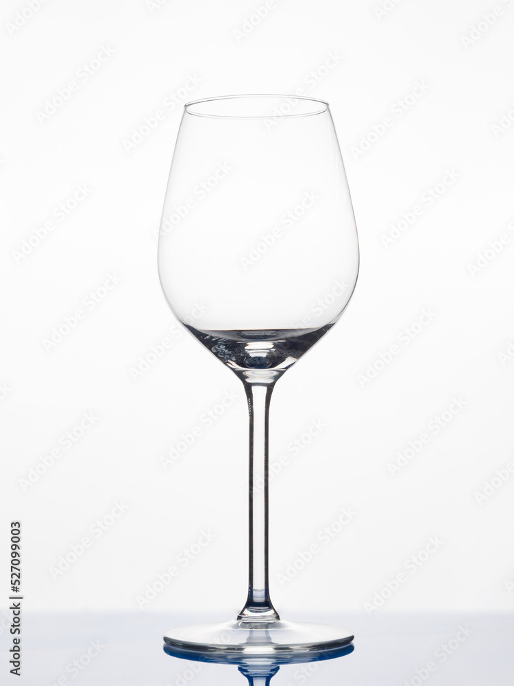 Glass wine glass on a white background. Empty goblet. Glass wine glass on a white background. Empty goblet.
