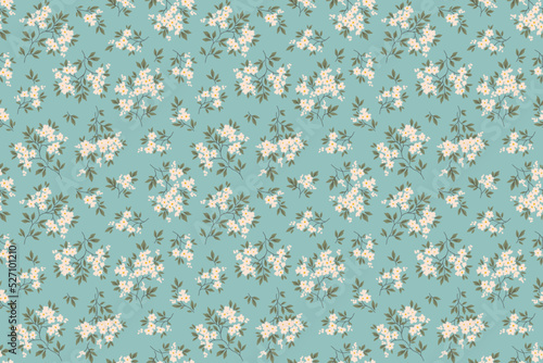 Vintage seamless floral pattern. Liberty style background of small white flowers. Small flowers scattered over a blue gray background. Stock vector for printing on surfaces. Abstract flowers.
