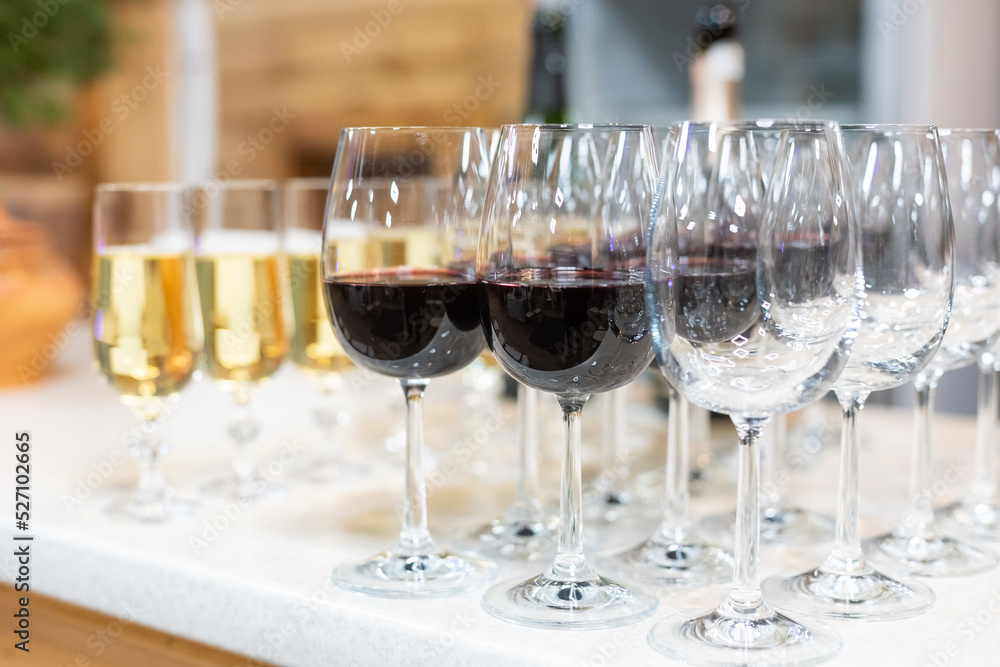 Many glasses of different wine in a row on bar counter Many glasses of different wine in a row on bar counter