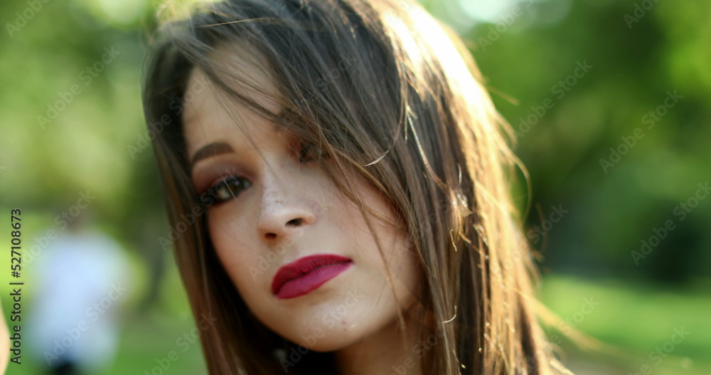 Pretty hispanic millennial woman face portrait looking to camera Pretty hispanic millennial woman face portrait looking to camera