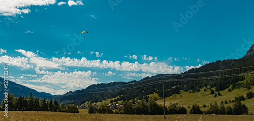 Beautiful alpine summer view with paragliders at the famous Tannheimer Tal valley  Graen  Tyrol  Austria