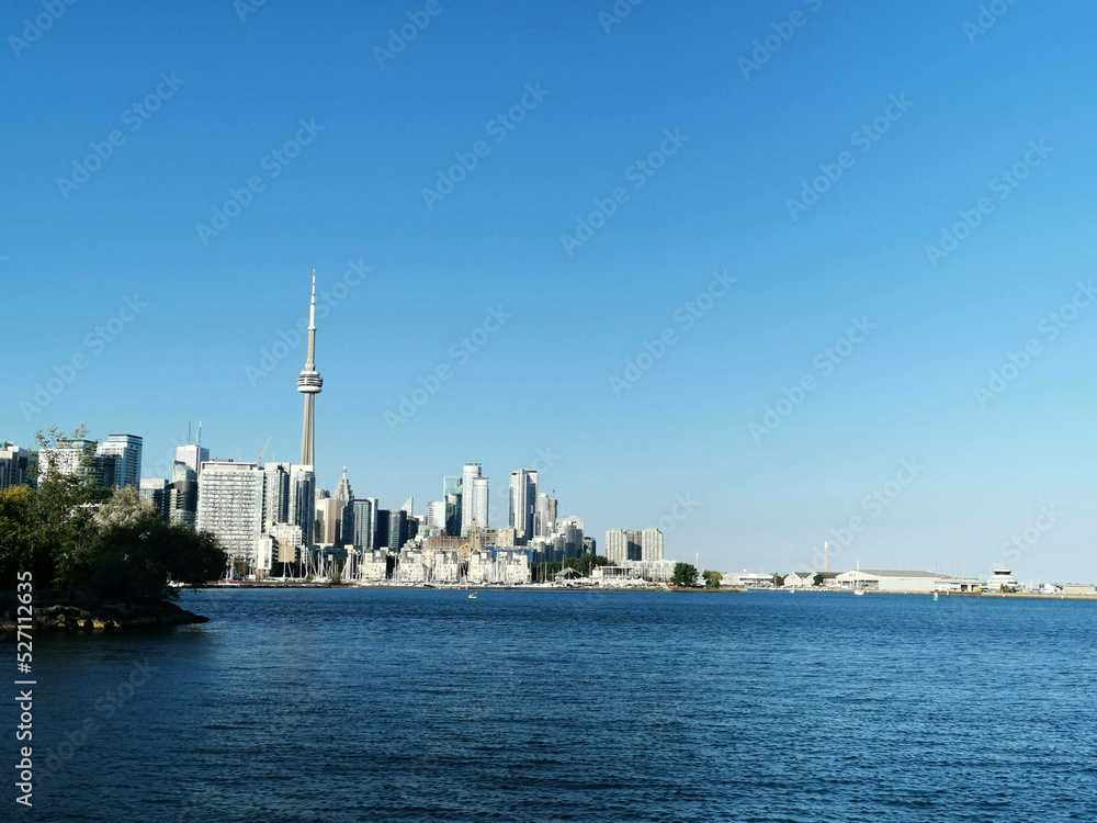 Trillium Park in Toronto canada view to cn tower skyline city over sea water harbour lake good weather weekend