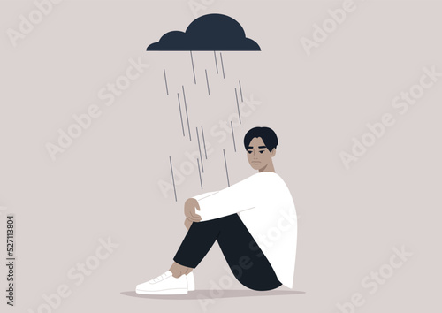 A young upset character hugging their knees, a black rain cloud hovering above them