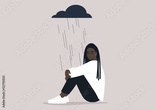 A young upset character hugging their knees, a black rain cloud hovering above them