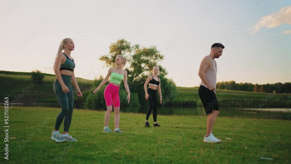 sport workout for good-lookign and keeping fit in nature in summer, group fitness with three women sport workout for good-lookign and keeping fit in nature in summer, group fitness with three women
