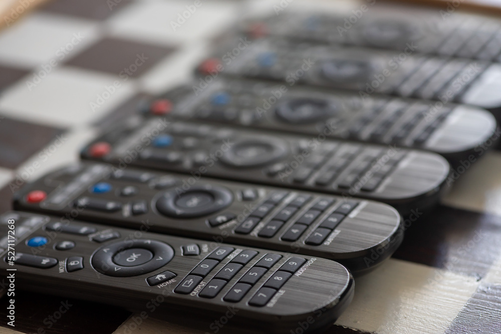 Close-up on a remote control sitting on a table Close-up on a remote control sitting on a table