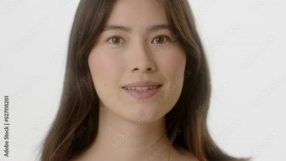 Beauty Woman face Portrait. Beautiful Spa model Girl with Perfect Fresh Clean Skin. Asian Female with Brunette hair looking at camera and smiling. Youth and Skin Care Concept. Isolated on a white Beauty Woman face Portrait. Beautiful Spa model Girl with Perfect Fresh Clean Skin. Asian Female with Brunette hair looking at camera and smiling. Youth and Skin Care Concept. Isolated on a white