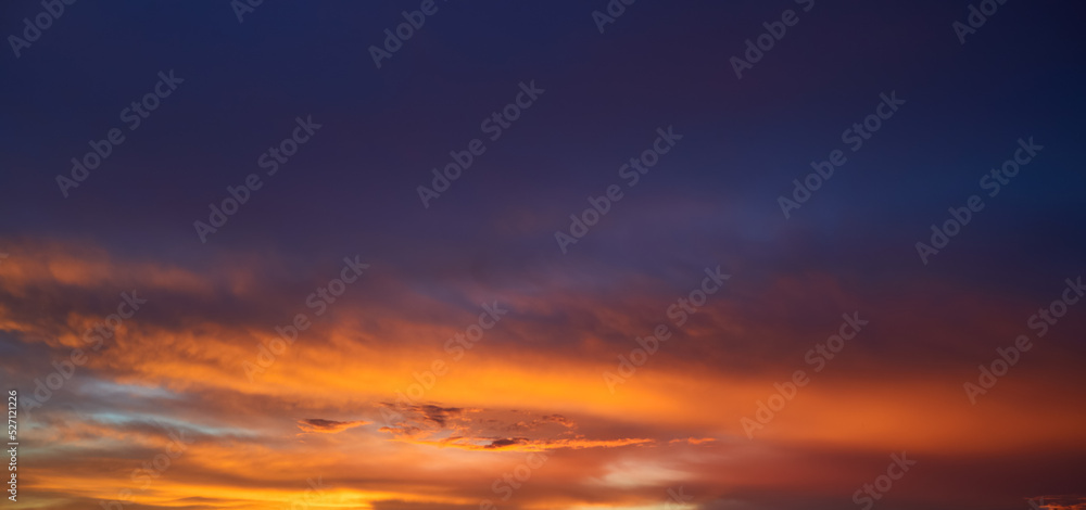 Real amazing sunrise or sunset sky with gentle colorful clouds