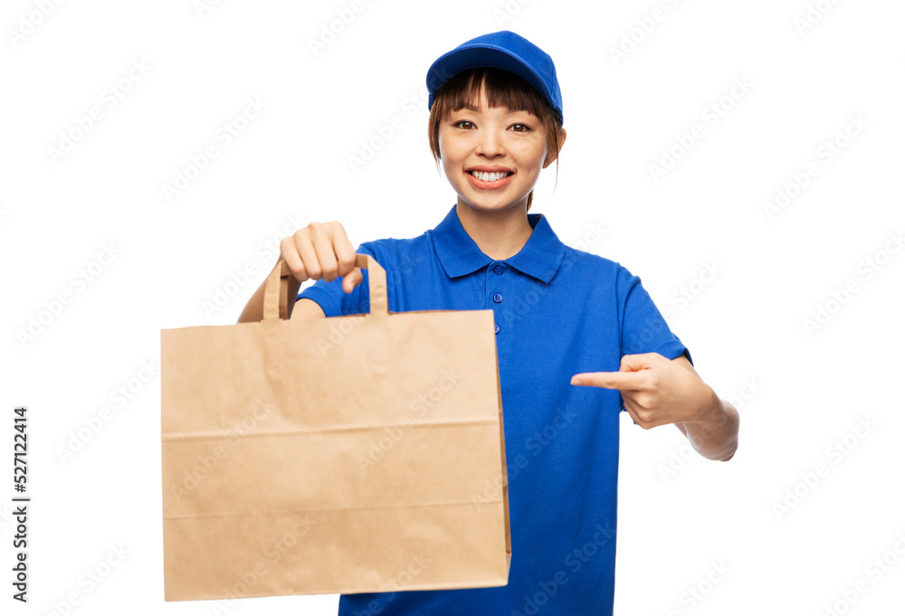 service and job concept - happy smiling delivery woman in blue uniform with takeaway food in paper bag over white background service and job concept - happy smiling delivery woman in blue uniform with takeaway food in paper bag over white background