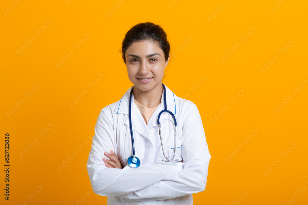 Portrait of indian doctor woman in white medical gown stethoscope isolated on yellow background. Portrait of indian doctor woman in white medical gown stethoscope isolated on yellow background.
