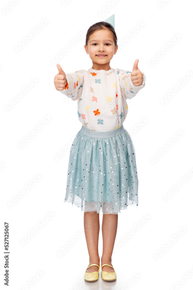 birthday, childhood and people concept - portrait of smiling little girl in party hat showing thumbs up over white background birthday, childhood and people concept - portrait of smiling little girl in party hat showing thumbs up over white background