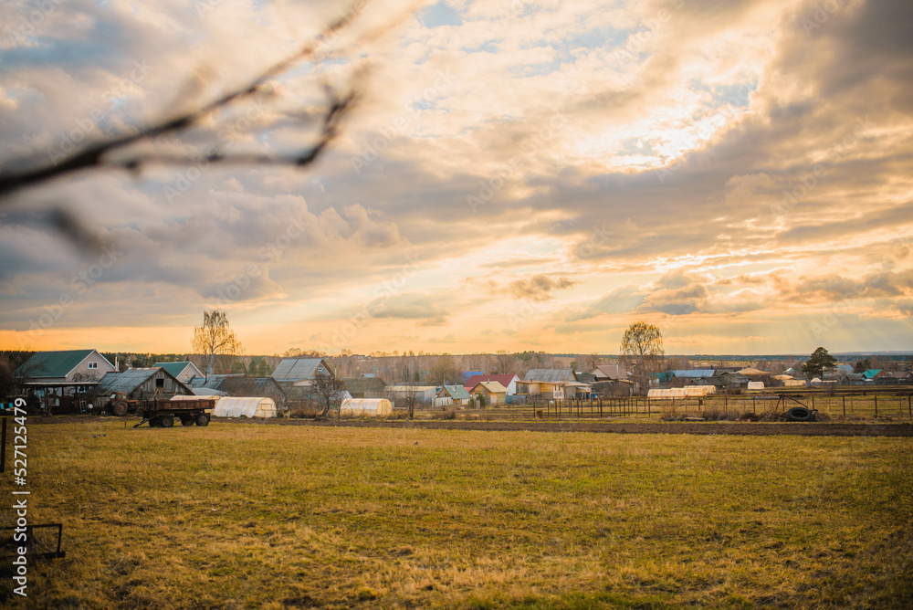 russian village landscape at sunset russian village landscape at sunset