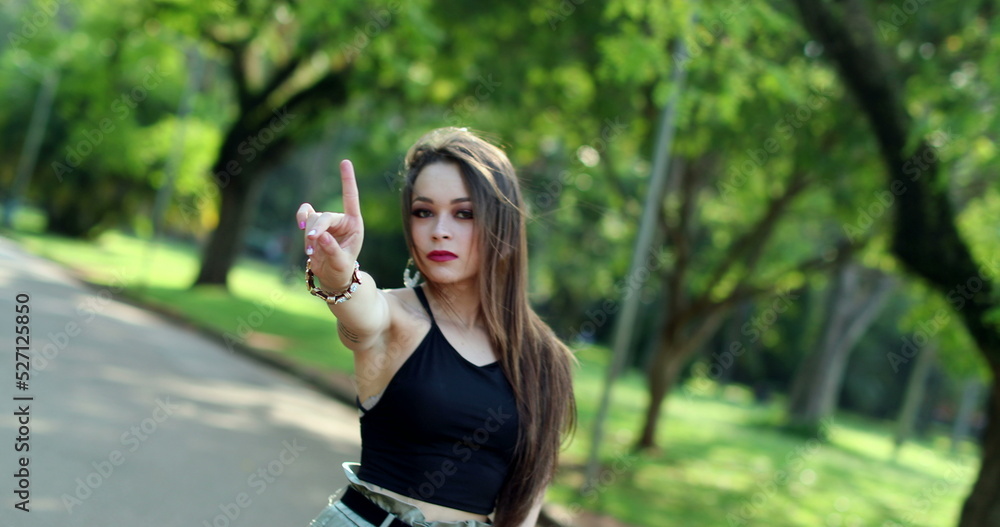 Unhappy pretty girl waving NO with finger. Young woman defending her rights Unhappy pretty girl waving NO with finger. Young woman defending her rights