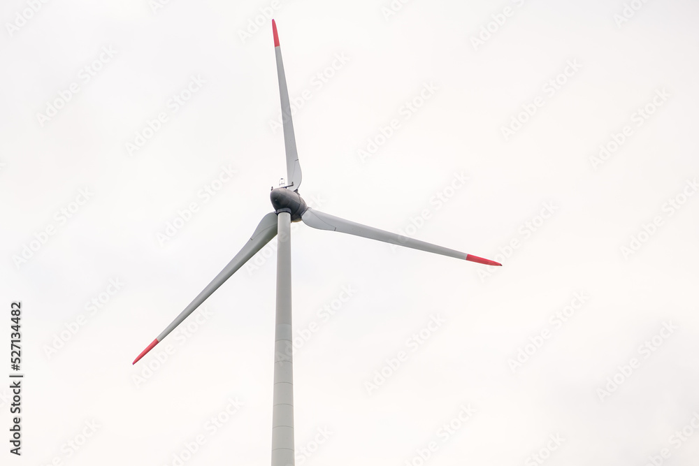 Windmill propeller against the grey sky. Generation of green energy. Windmill propeller against the grey sky. Generation of green energy.