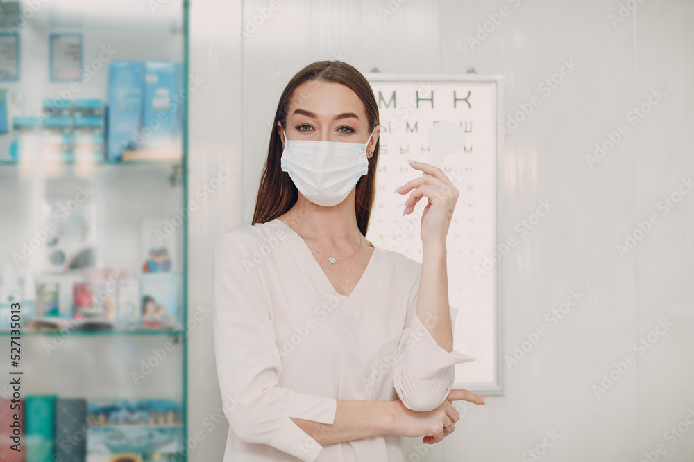 Portrait of happy young woman during eye exam at optometrist optician. Portrait of happy young woman during eye exam at optometrist optician.