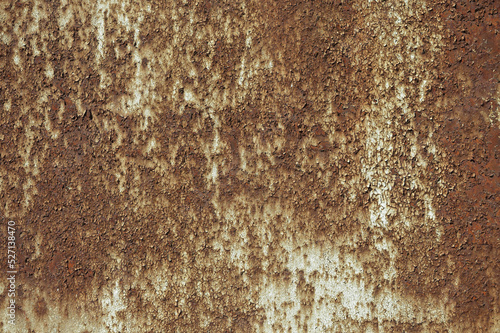 a rusty wall, in the photo a metal wall covered with rust and old paint