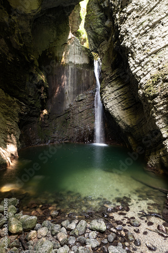 Kozjak waterfall in slovenia falling into a lake