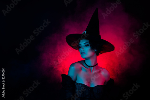 Fototapeta Photo of charming lady magician on theme carnival fest wear witchery costume iso
