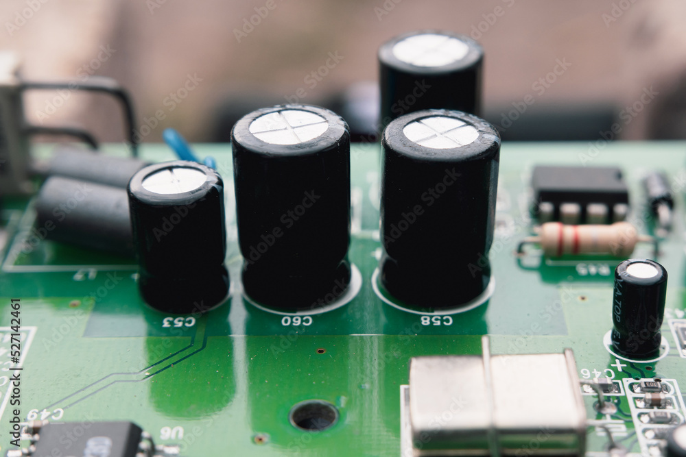Electronic components on a printed circuit board. Resistor, inductor and capacitor on PCB. Electronic components on a printed circuit board. Resistor, inductor and capacitor on PCB.