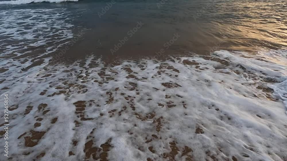 Small wave coming into the beach shore. Small wave coming into the beach shore.